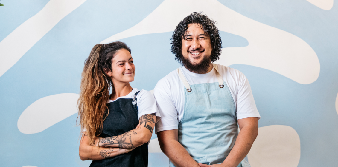 Two smiling venue workers.