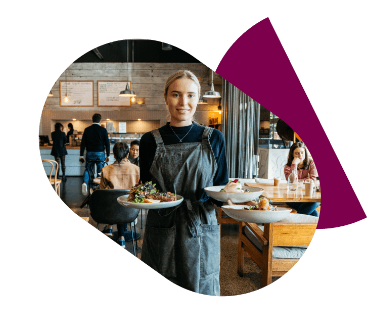 female waitstaff in venue carrying 3 plates